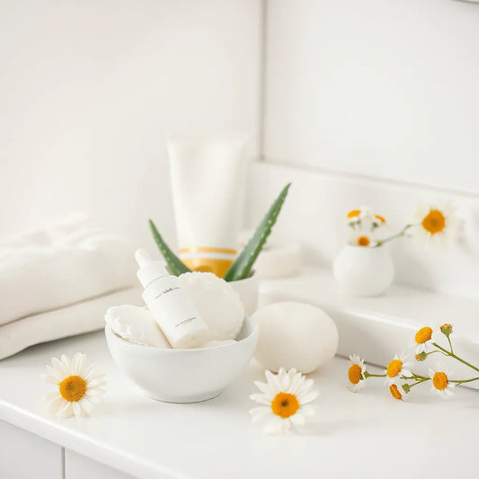 Gentle skincare products and calming aloe and chamomile arranged on a clean vanity