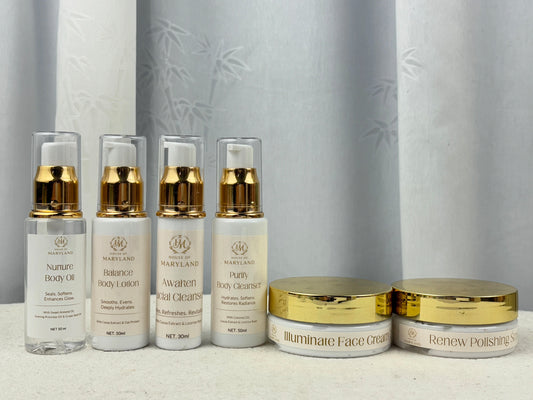 Skincare travel ritual set with 4 pump bottles and 2 gold-lidded face creams